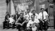 Group posing in front of Sweet Shop 1920,'s