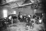 Young men learning auto mechanics 1920's