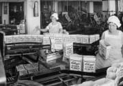 Women filling boxes of Kelloggs cornflakes