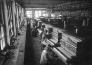 Girls tuning pianos in factory