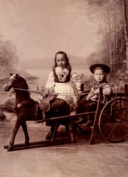 Children posing antique cabinet photo