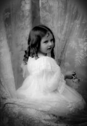 A young girl in a fancy dress