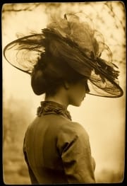 A woman in 1910 in a fancy hat