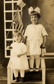 Children posing with flags 1910's